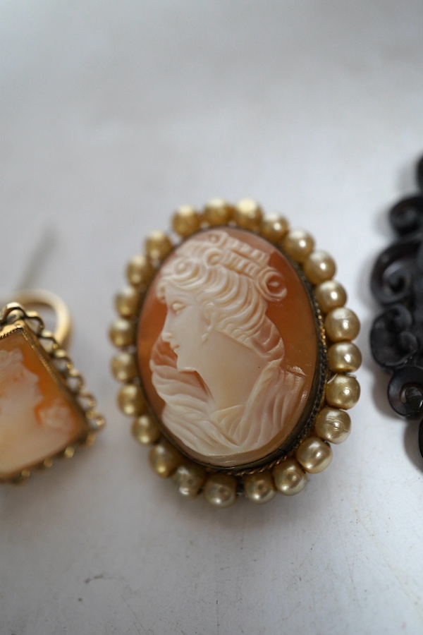 A yellow metal shell cameo ring, a brooch and a pendant. Condition - fair